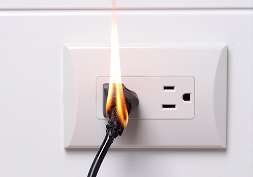 burning electrical cord in plug