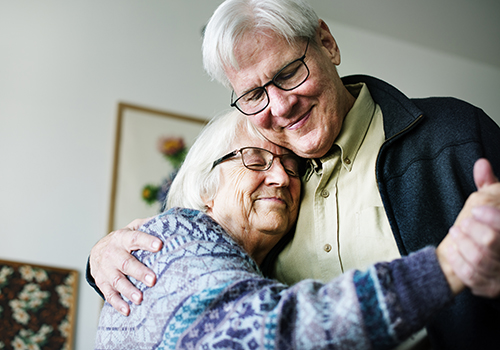 elderly couple dancing