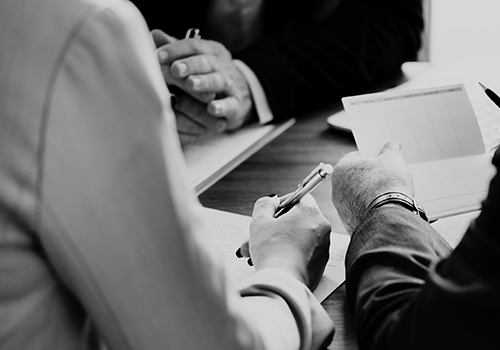 Mediation-Overview-Thumbnail small business group discussion over documents