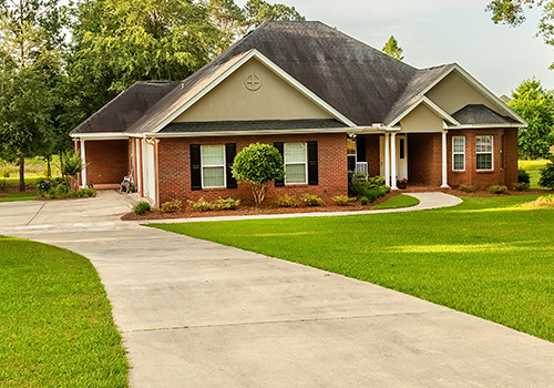 Residential-Mediation-Thumb red brick single story residential property front façade
