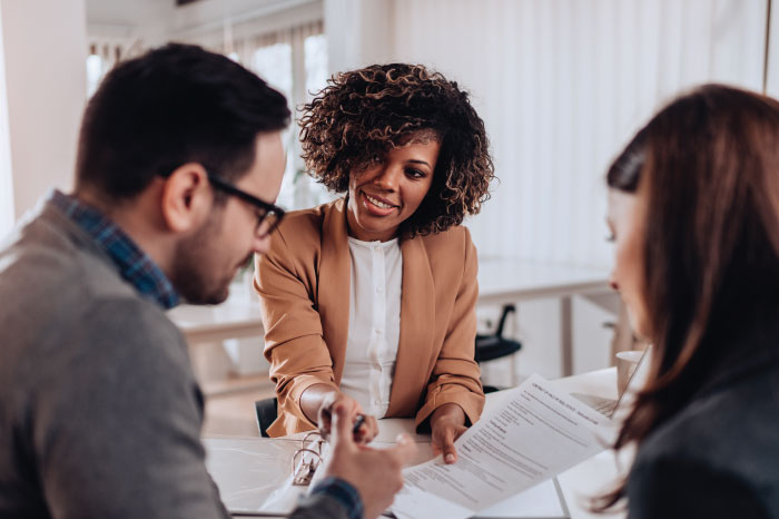 Insurance agent assisting couple